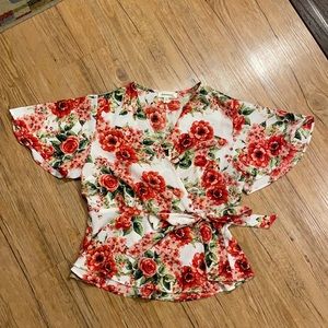 Red floral wrap blouse
